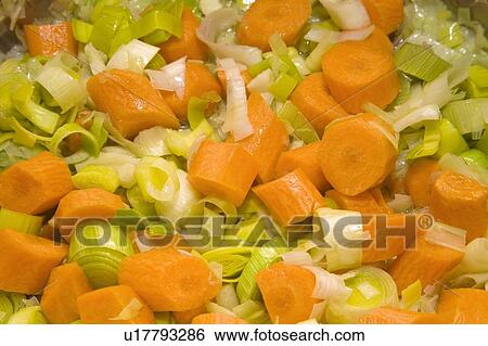 Chopped carrots, leeks and onions View Large Photo Image Stock Photograph - Chopped carrots, leeks and onions. Fotosearch