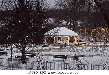 Christmas lights decorating a snow covered park and gazebo View Large Photo Image Stock Image - Christmas lights decorating a snow covered park and gazebo. Fotosearch