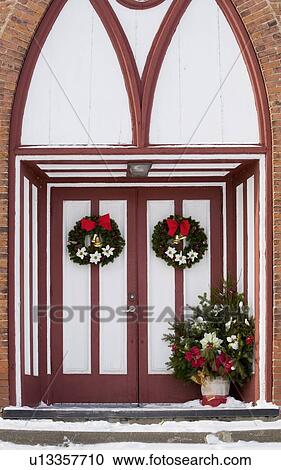 Church doors adorned with Christmas decorations View Large Photo Image Stock Image - Church doors adorned with Christmas decorations. Fotosearch