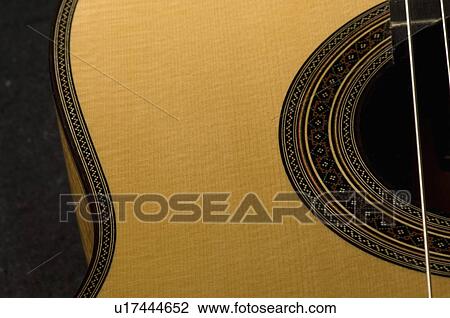 Close-up of an acoustic guitar View Large Photo Image Stock Image - Close-up of an acoustic guitar. Fotosearch
