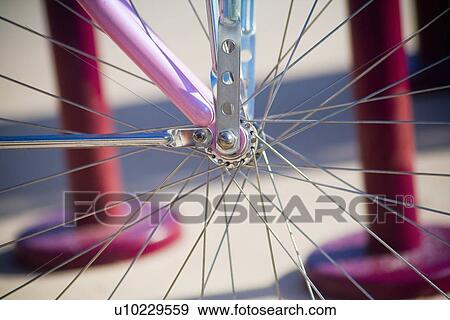 Close up of spokes on a pink bicycle, View Large Photo Image Stock Photo - Close up of spokes on a pink bicycle, . Fotosearch