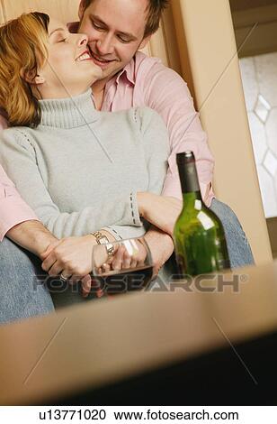 Couple celebrates with wine View Large Photo Image Stock Image - Couple celebrates with wine. Fotosearch
