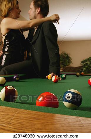 Couple embraces by pool table View Large Photo Image Stock Image - Couple embraces by pool table. Fotosearch