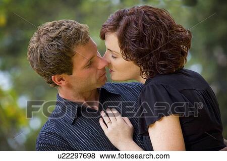 Stock Photo - Couple kissing. Fotosearch
