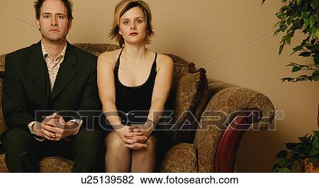 Couple sitting side by side View Large Photo Image Stock Image - Couple sitting side by side. Fotosearch