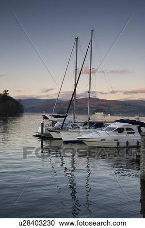 Stock Image - Cumbria, England; Boats in harbour. Fotosearch