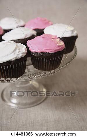 Cupcakes on serving plate View Large Photo Image Stock Photograph - Cupcakes on serving plate. Fotosearch