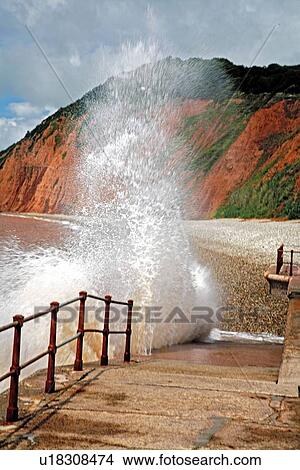 Devon, England, United Kingdom; Sea water spraying up against beach walkway View Large Photo Image Picture - Devon, England, United Kingdom; Sea water spraying up against beach walkway. Fotosearch