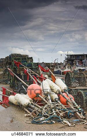 East Riding, Yorkshire, England; Fishing floats and lobster pots on the foreshore View Large Photo Image Stock Image - East Riding, Yorkshire, England; Fishing floats and lobster pots on the foreshore. Fotosearch