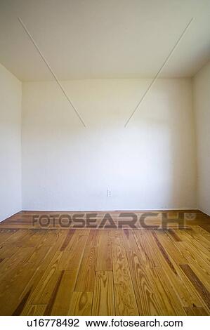 Empty room with wooden floors and white walls View Large Photo Image Stock Image - Empty room with wooden floors and white walls. Fotosearch