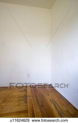 Stock Photo - Empty room with wooden floors and white walls. Fotosearch
