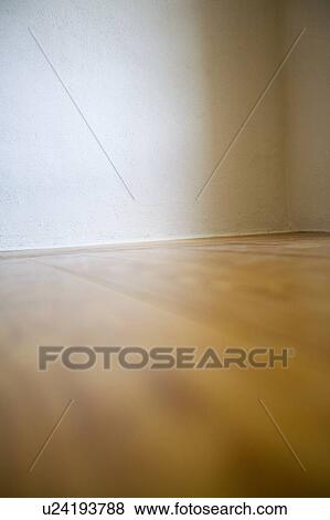 Empty room with wooden floors and white walls View Large Photo Image Stock Photo - Empty room with wooden floors and white walls. Fotosearch