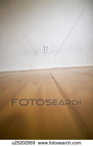 Empty room with wooden floors and white walls View Large Photo Image Stock Photo - Empty room with wooden floors and white walls. Fotosearch