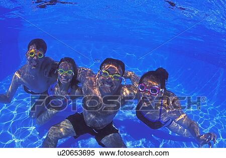 Family group in swimming pool View Large Photo Image Stock Photography - Family group in swimming pool. Fotosearch