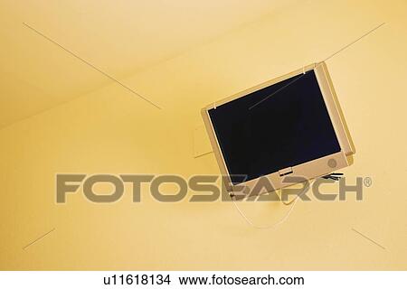 Picture - Flat screen TV on a wall . Fotosearch