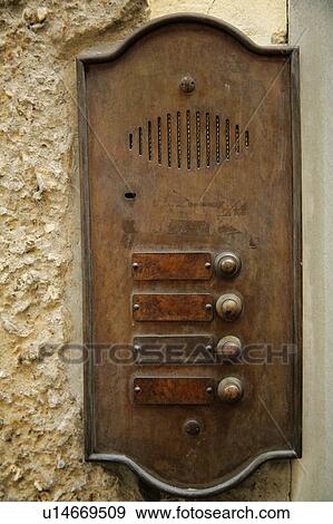 Stock Photo - Florence, Italy, Copper doorbells and apartment name plates. Fotosearch