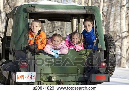 Stock Image - Four kids in a truck. Fotosearch