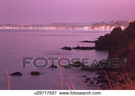Stock Photo - Fuengirola, Malaga, Spain; Fuengirola on the Costa del Sol seen at night. Fotosearch