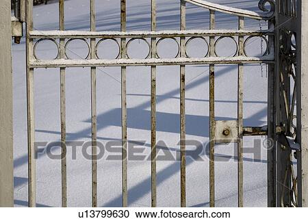Stock Image - Gate covered in snow. Fotosearch