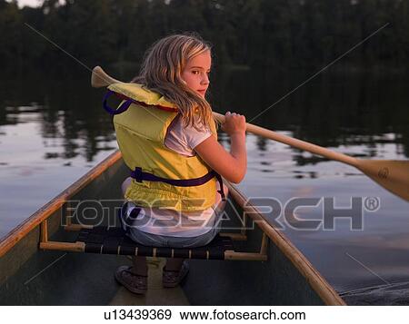 Stock Photo - Girl in canoe. Fotosearch