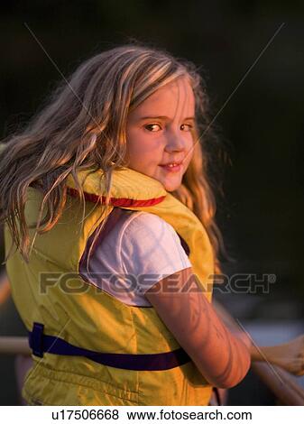 Girl in personal floatation device View Large Photo Image Stock Photo - Girl in personal floatation device. Fotosearch