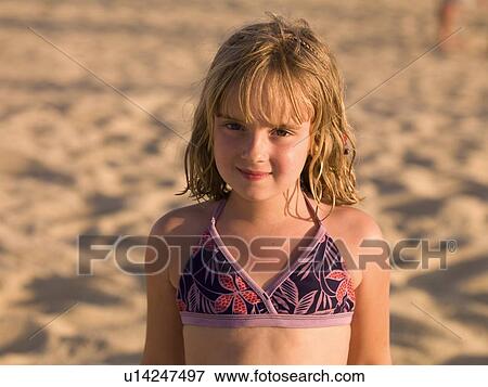 Stock Photo - Girl on the beach. Fotosearch