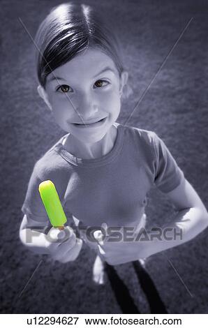 Girl with popsicle View Large Photo Image Stock Photo - Girl with popsicle. Fotosearch