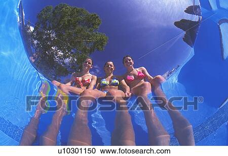 Girls dangling feet in pool View Large Photo Image Stock Image - Girls dangling feet in pool. Fotosearch