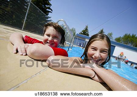 Stock Photo - Girls in the swimming pool. Fotosearch