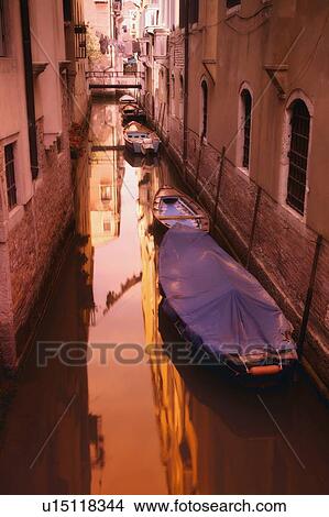 Picture - Gondolas in a residential canal side street in Venice Italy Europe. Fotosearch