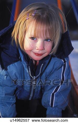 Grinning girl on slide View Large Photo Image Stock Photo - Grinning girl on slide. Fotosearch