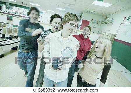 Stock Image - Group goes bowling. Fotosearch
