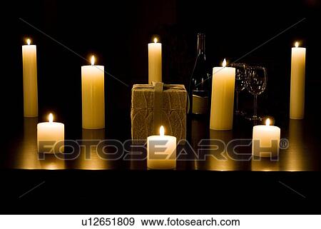 Group of lit candles on a table View Large Photo Image Stock Photo - Group of lit candles on a table. Fotosearch