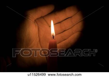 Hand and candle View Large Photo Image Stock Photo - Hand and candle . Fotosearch