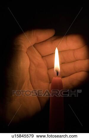 Stock Photo - Hand and candle . Fotosearch