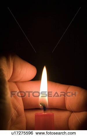 Hand and candle View Large Photo Image Stock Photograph - Hand and candle . Fotosearch