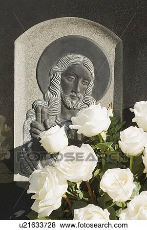Headstone with bouquet of flowers View Large Photo Image Stock Photo - Headstone with bouquet of flowers. Fotosearch