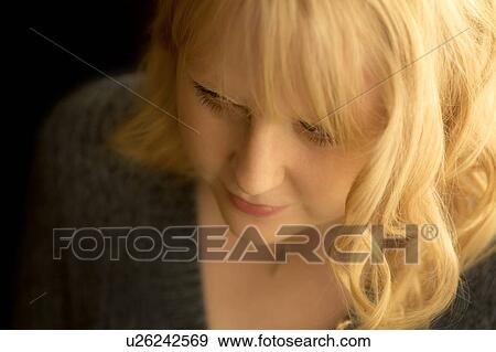 High angle portrait of a young blonde woman View Large Photo Image Stock Photo - High angle portrait of a young blonde woman. Fotosearch