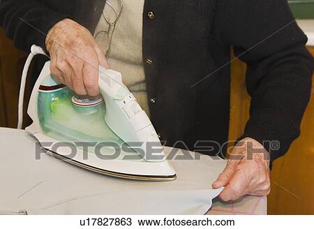 Housework; Older woman ironing View Large Photo Image Stock Image - Housework; Older woman ironing. Fotosearch