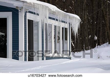 Icicles hanging off a rain gutter View Large Photo Image Stock Photo - Icicles hanging off a rain gutter. Fotosearch