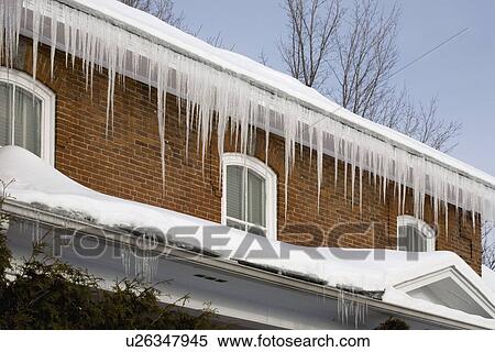 Icicles hanging off rain gutters View Large Photo Image Stock Photography - Icicles hanging off rain gutters. Fotosearch