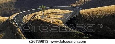 Idaho, USA; Road winding around hilly landscape View Large Photo Image Stock Image - Idaho, USA; Road winding around hilly landscape. Fotosearch
