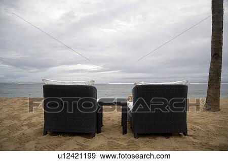 Indonesia; Lounging chairs on the beach View Large Photo Image Stock Photo - Indonesia; Lounging chairs on the beach. Fotosearch