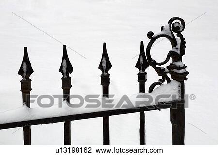 Iron gate covered in snow View Large Photo Image Stock Image - Iron gate covered in snow. Fotosearch