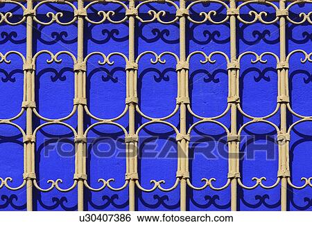 Iron railings against blue walls, Majorelle Gardens, Marrakech, Morocco View Large Photo Image Stock Photograph - Iron railings against blue walls, Majorelle Gardens, Marrakech, Morocco . Fotosearch