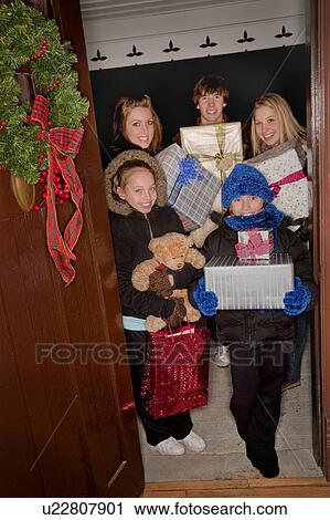 Stock Image - Kids delivering Christmas gifts. Fotosearch