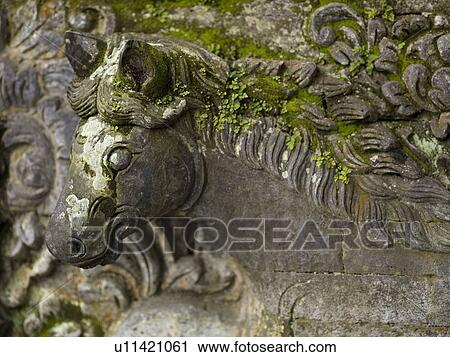 Stock Image - Klungkung, Bali, Indonesia; Carved horse. Fotosearch