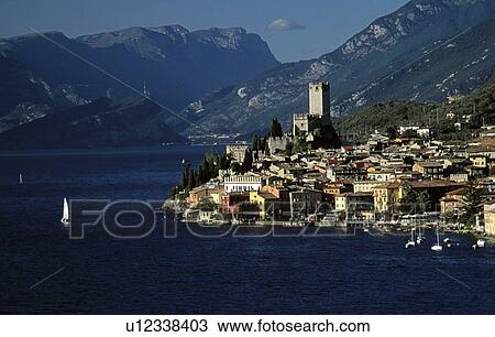 Lake Garda, Italy; Beautiful town beneath the alps View Large Photo Image Stock Image - Lake Garda, Italy; Beautiful town beneath the alps. Fotosearch