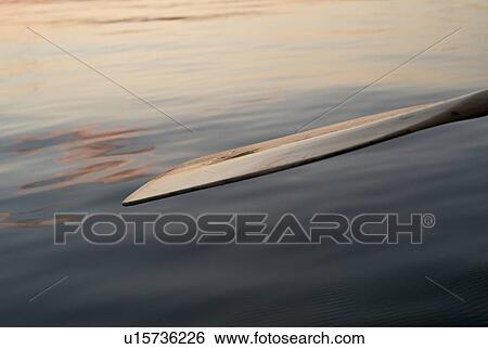 Lake of the Woods, Ontario, Canada; An oar resting over a placid lake View Large Photo Image Stock Photograph - Lake of the Woods, Ontario, Canada; An oar resting over a placid lake. Fotosearch