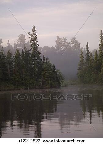 Lake of the Woods, Ontario, Canada; Mist rises over lake View Large Photo Image Stock Image - Lake of the Woods, Ontario, Canada; Mist rises over lake. Fotosearch